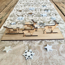 Load image into Gallery viewer, Wooden Santa Sleigh and Reindeer Personalised With Names and Family Name
